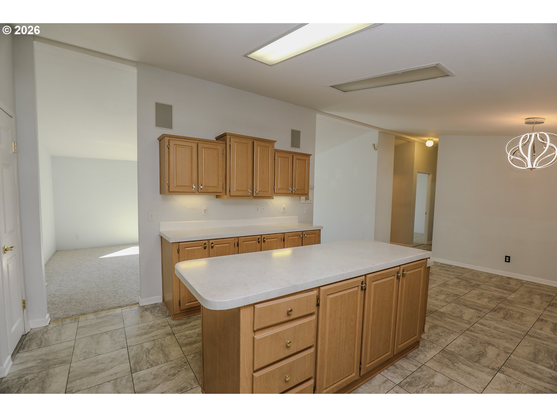 210 Northwest Timothy Avenue Winston, OR 97496 - Photo 15 of 48 a kitchen with a wooden floor and cabinets