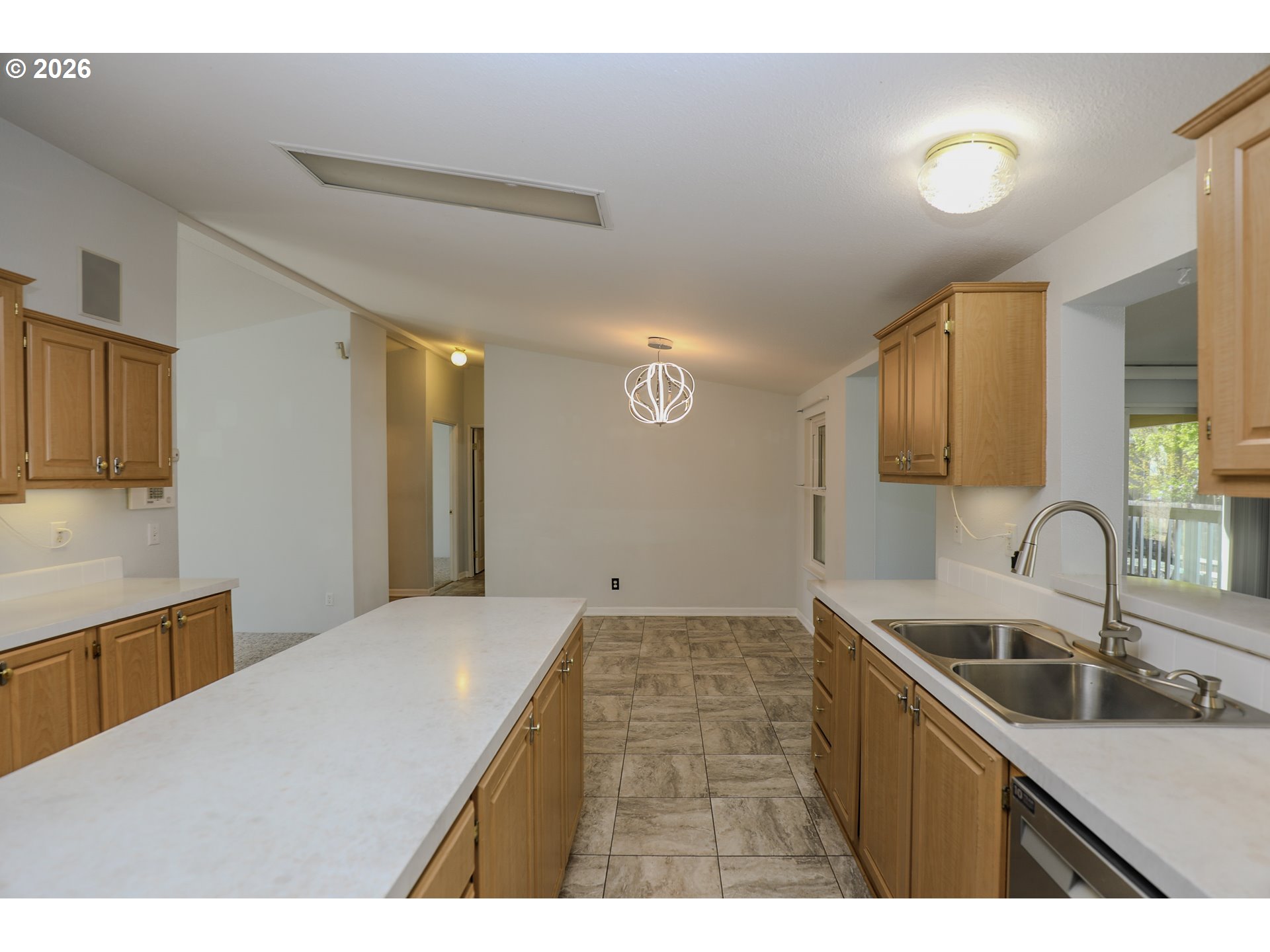 210 Northwest Timothy Avenue Winston, OR 97496 - Photo 16 of 48 a kitchen with a sink cabinets and window