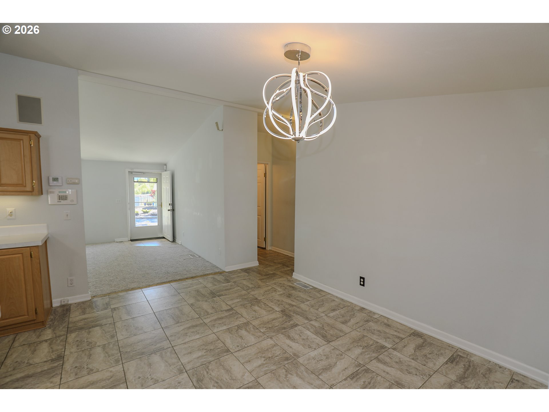 210 Northwest Timothy Avenue Winston, OR 97496 - Photo 18 of 48 a view of a hallway with a chandelier fan