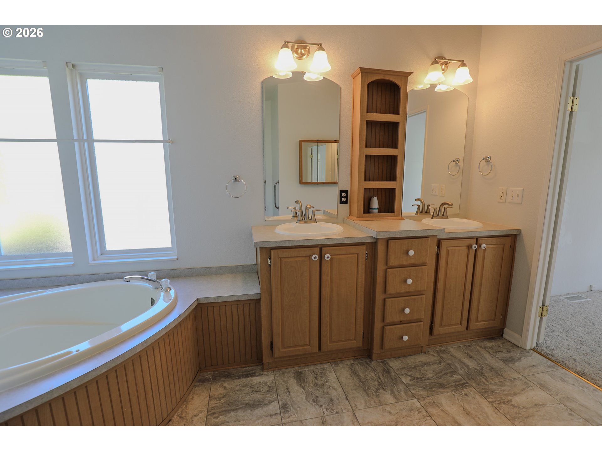 210 Northwest Timothy Avenue Winston, OR 97496 - Photo 21 of 48 a bathroom with a sink double vanity mirror and a bathtub