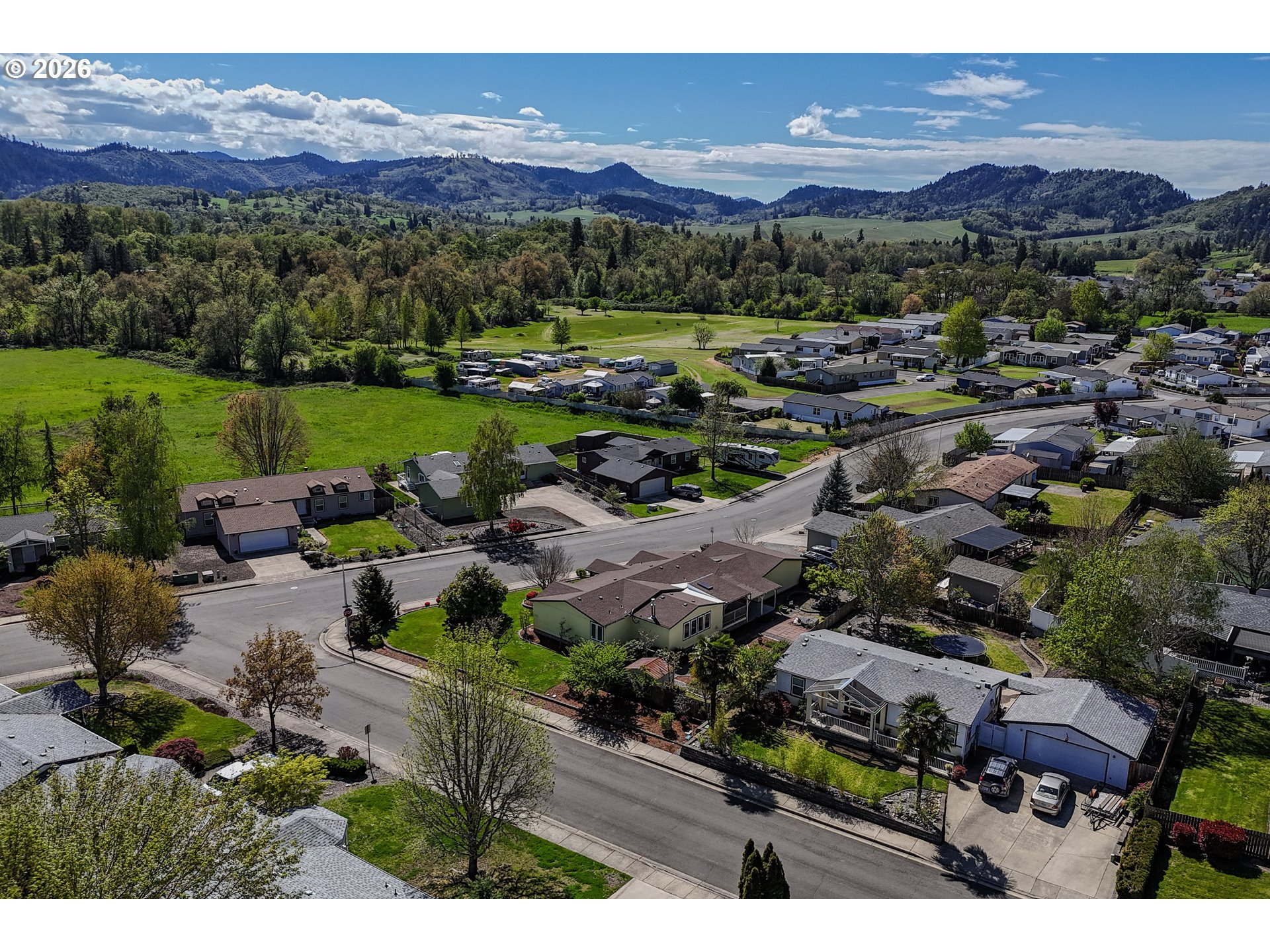 210 Northwest Timothy Avenue Winston, OR 97496 - Photo 48 of 48 a view of a city with mountains in the background