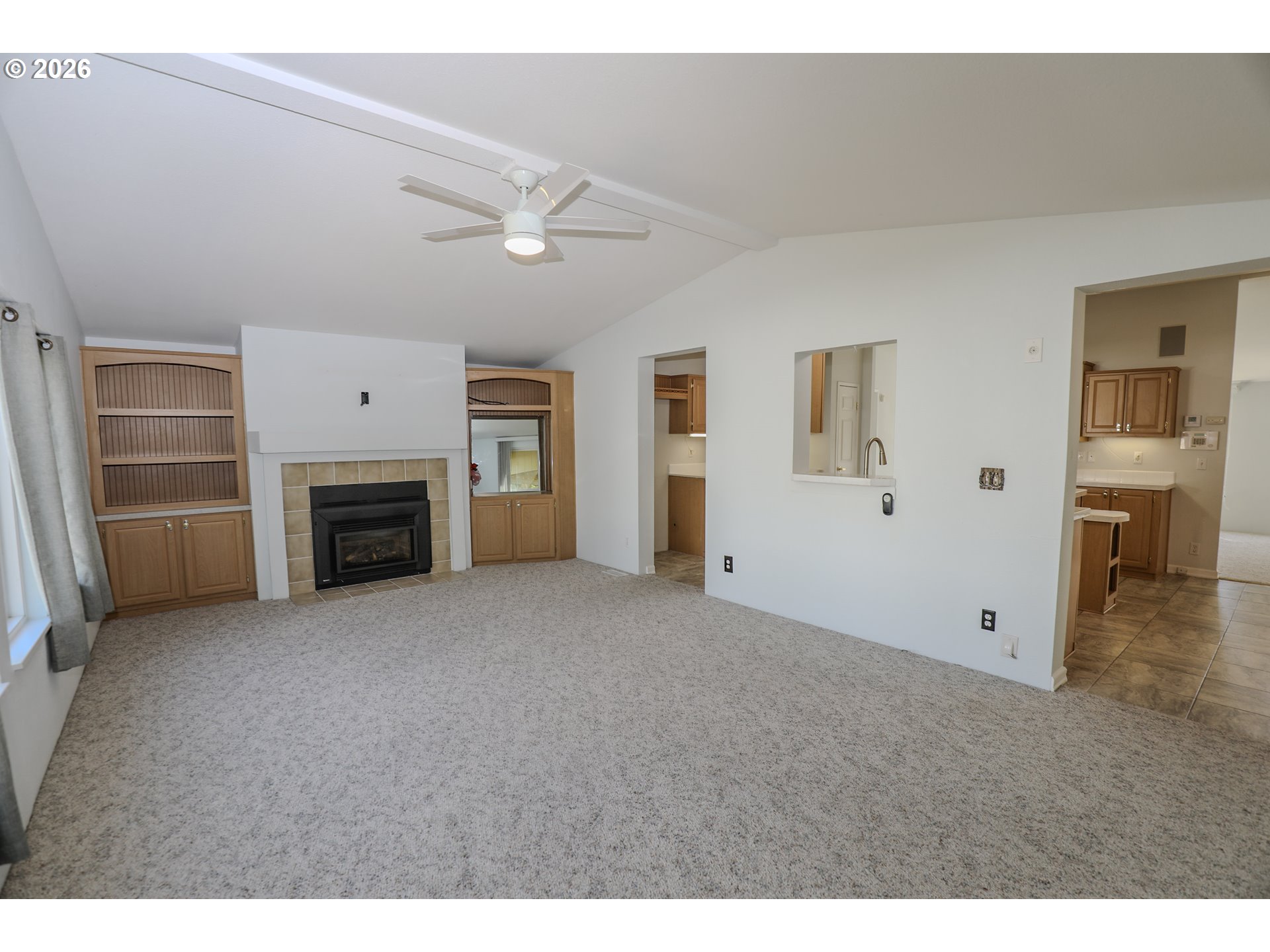 210 Northwest Timothy Avenue Winston, OR 97496 - Photo 7 of 48 a view of empty room with a fireplace