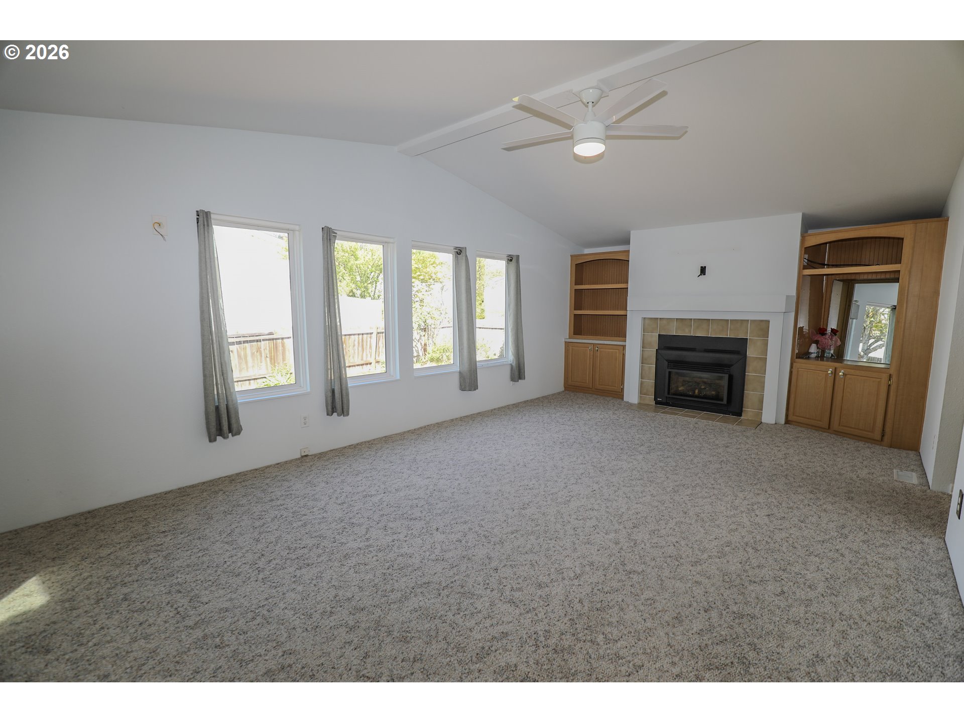 210 Northwest Timothy Avenue Winston, OR 97496 - Photo 8 of 48 a view of empty room with a fireplace