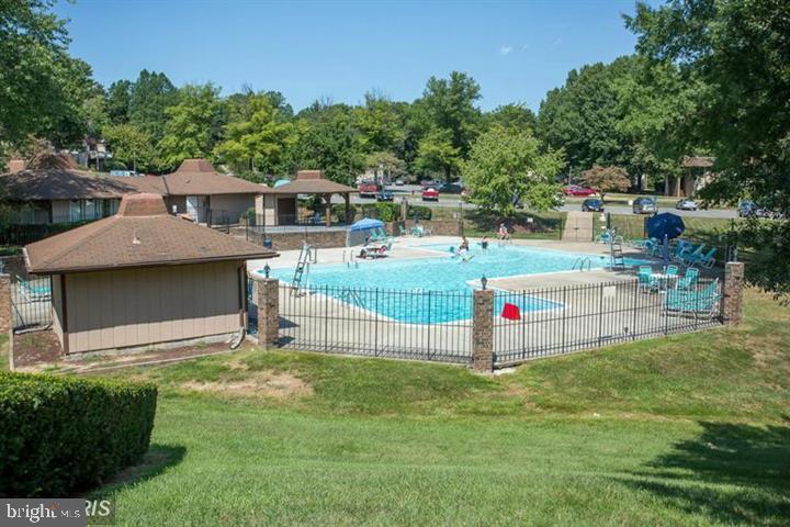 5808 Royal Ridge Drive, Unit L Springfield, VA 22152 - Photo 11 of 15 a view of a backyard with a garden and plants