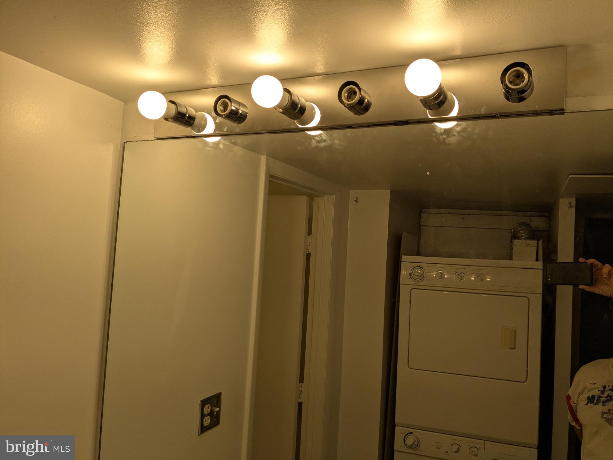 5808 Royal Ridge Drive, Unit L Springfield, VA 22152 - Photo 14 of 15 a bathroom with a mirror and a shower