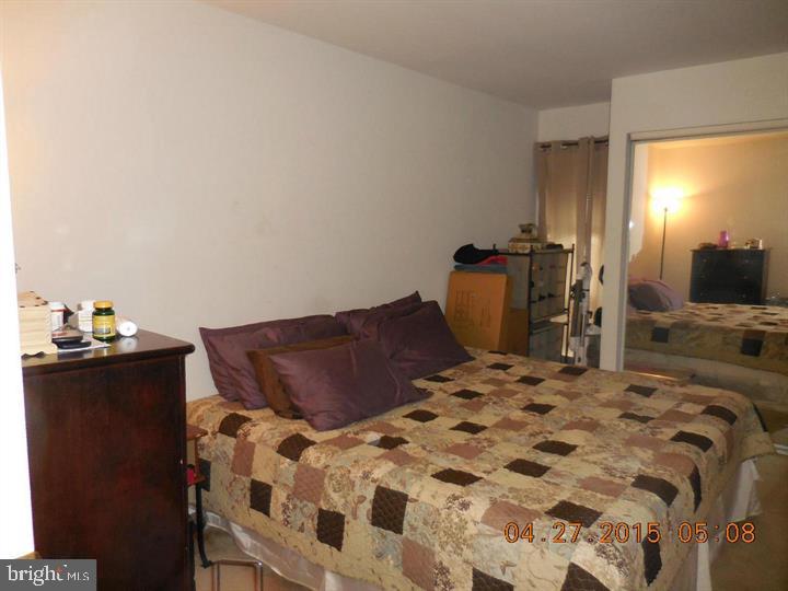 5808 Royal Ridge Drive, Unit L Springfield, VA 22152 - Photo 4 of 15 a bedroom with a bed and dresser