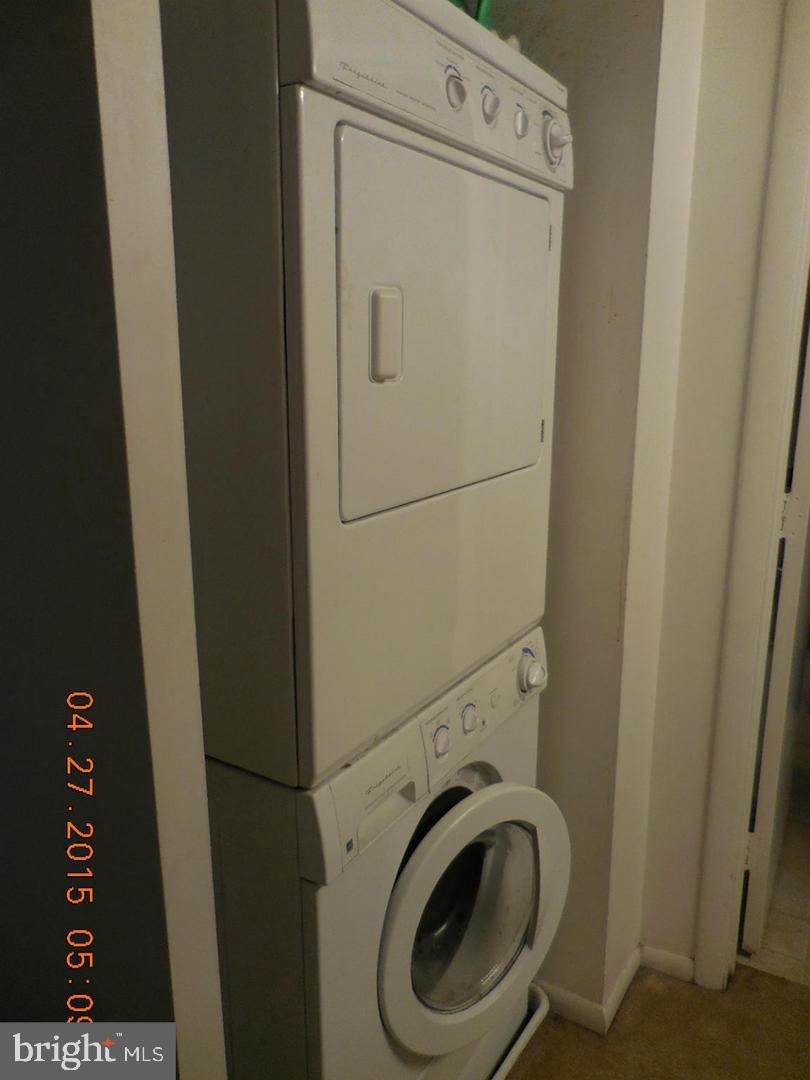 5808 Royal Ridge Drive, Unit L Springfield, VA 22152 - Photo 5 of 15 a utility room with dryer and washer