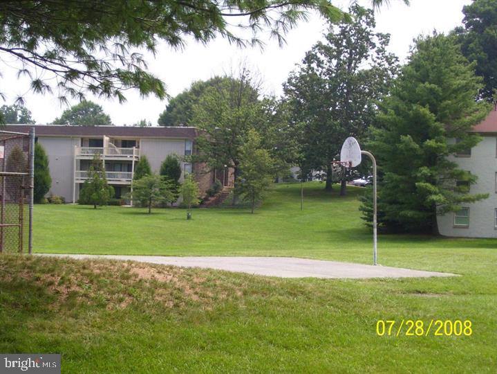 5808 Royal Ridge Drive, Unit L Springfield, VA 22152 - Photo 7 of 15 a view of a house with a backyard