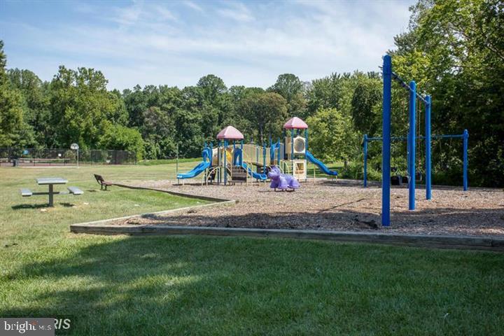 5808 Royal Ridge Drive, Unit L Springfield, VA 22152 - Photo 10 of 15 a view of a park with swings and slides