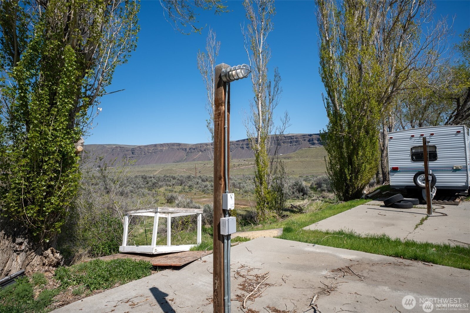 7199 Tarpiscan Road Malaga, WA 98828 - Photo 7 of 12 a view of a bench in front of a building