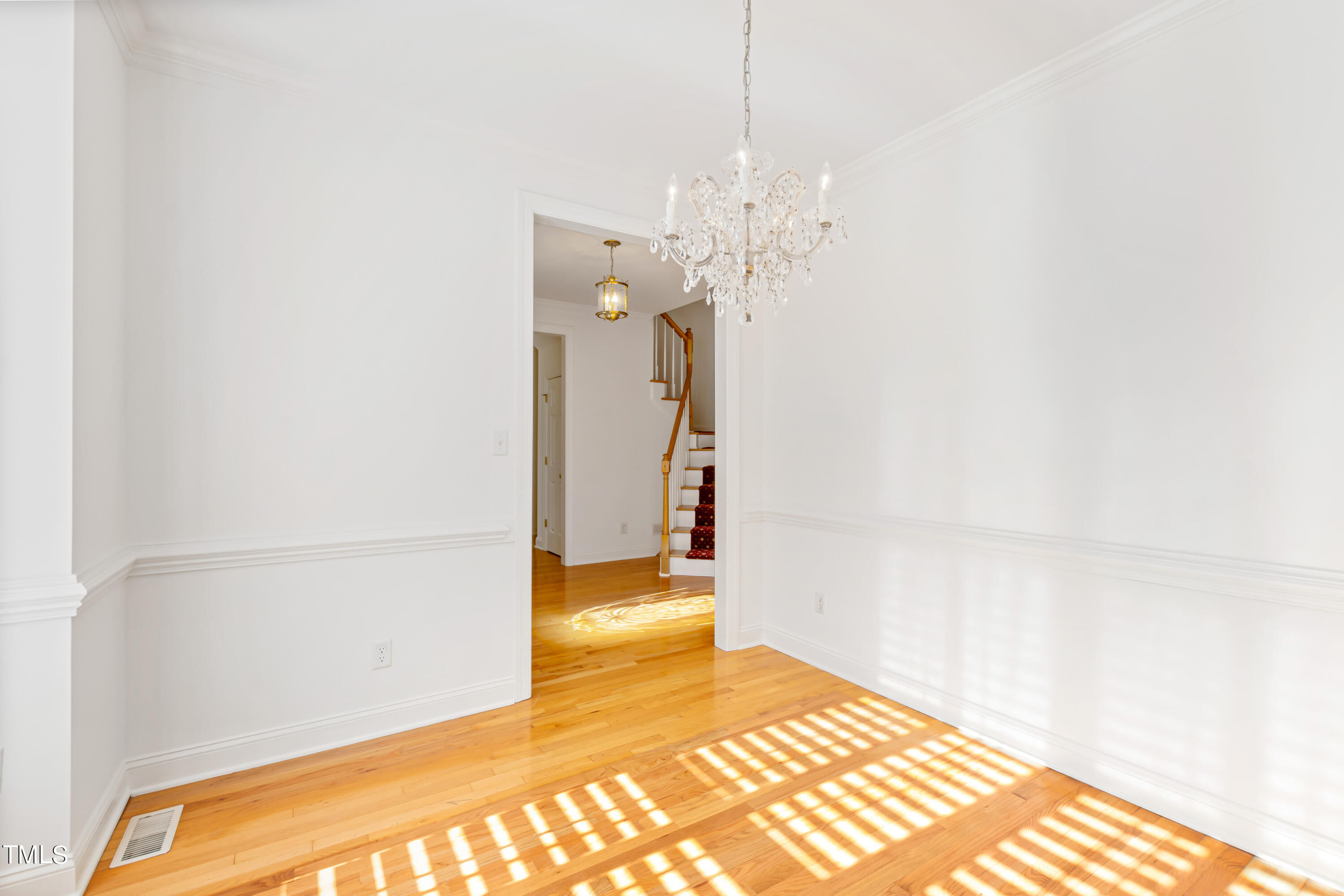 7412 Fontana Ridge Lane Raleigh, NC 27613 - Photo 10 of 52 a view of a livingroom with a chandelier