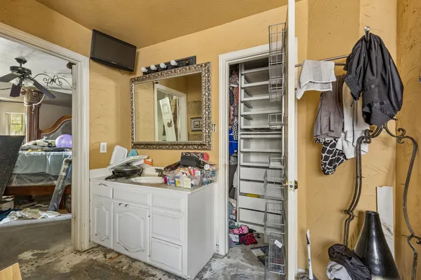 a bedroom with furniture and a wooden floor