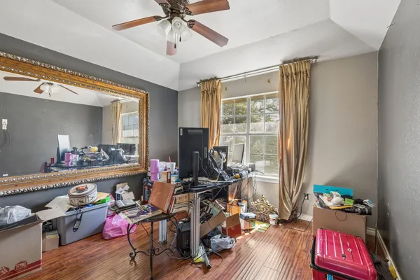 a view of a house with a backyard