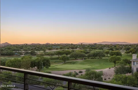 a view of city and mountain from a balcony