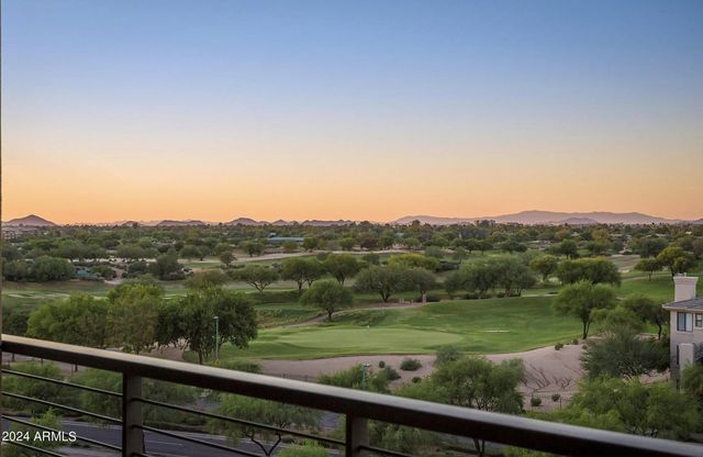 a view of city and mountain from a balcony