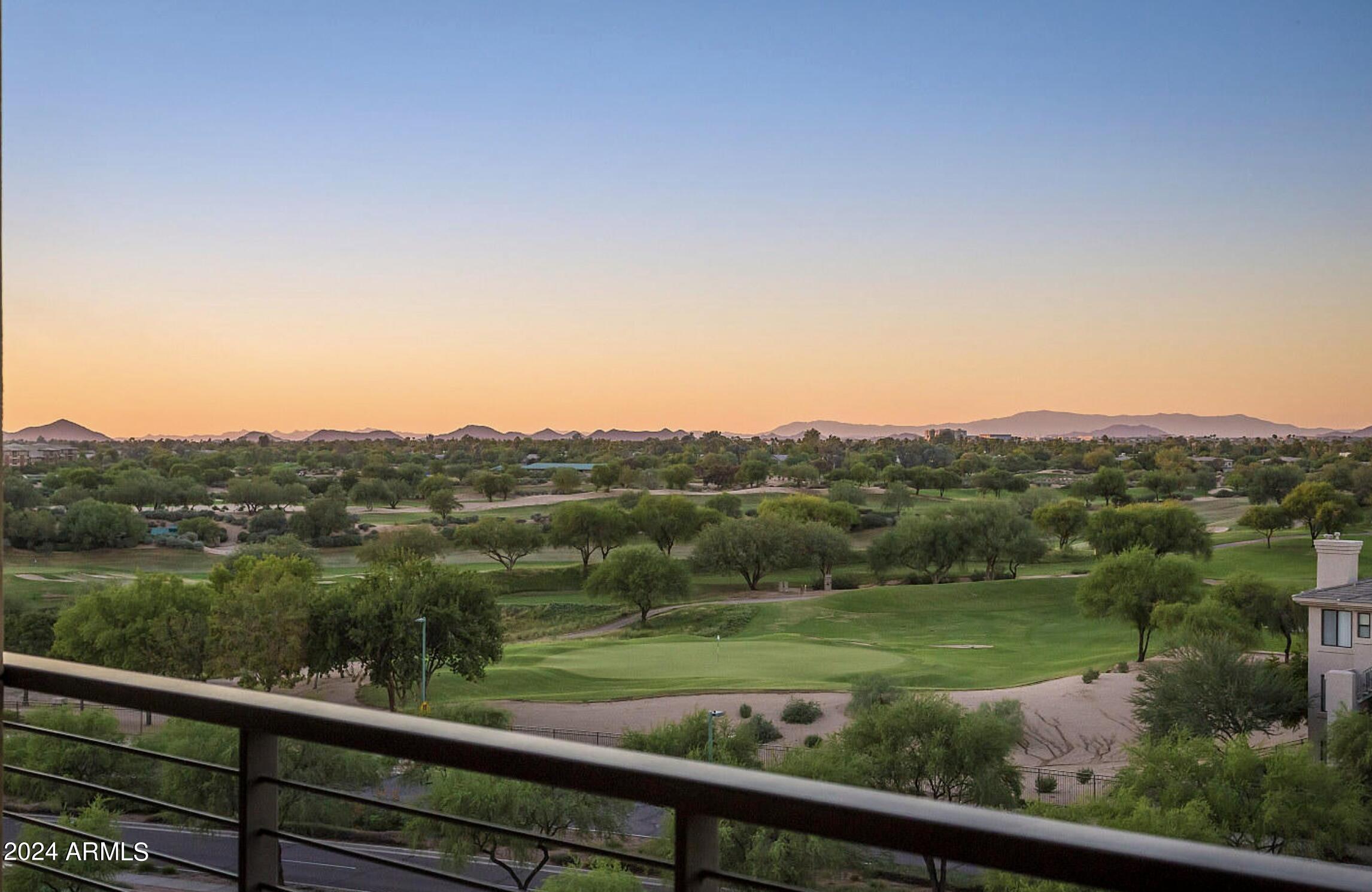 a view of city and mountain from a balcony