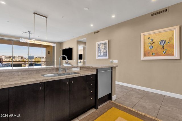 a kitchen with a sink cabinets and window