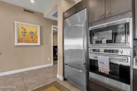 a kitchen with stainless steel appliances cabinets and a counter top