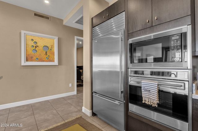 a kitchen with stainless steel appliances cabinets and a counter top