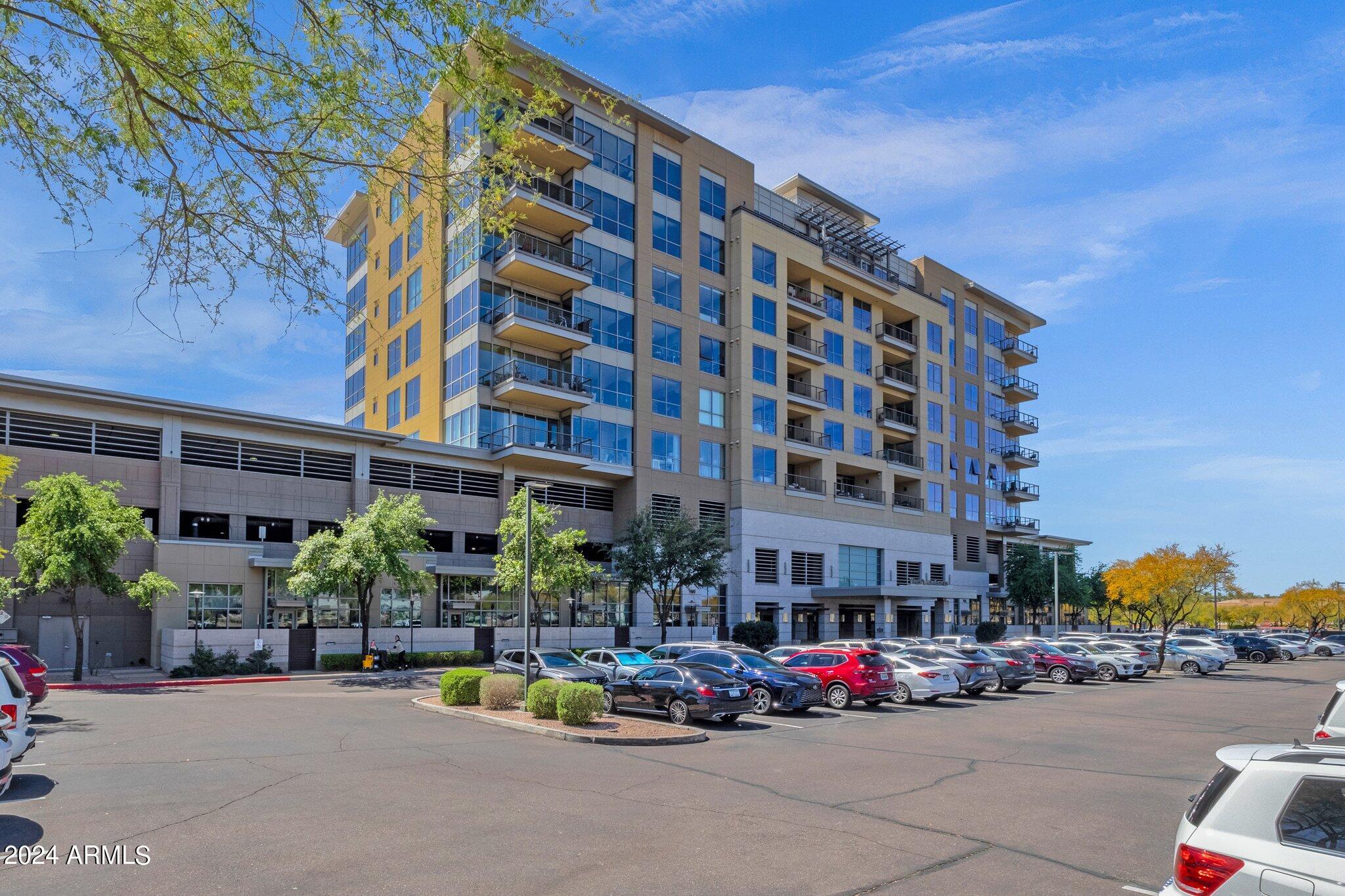 15215 North Kierland Boulevard, Unit 436 Scottsdale, AZ 85254 - Photo 2 of 44 a building view with balcony and flower plants
