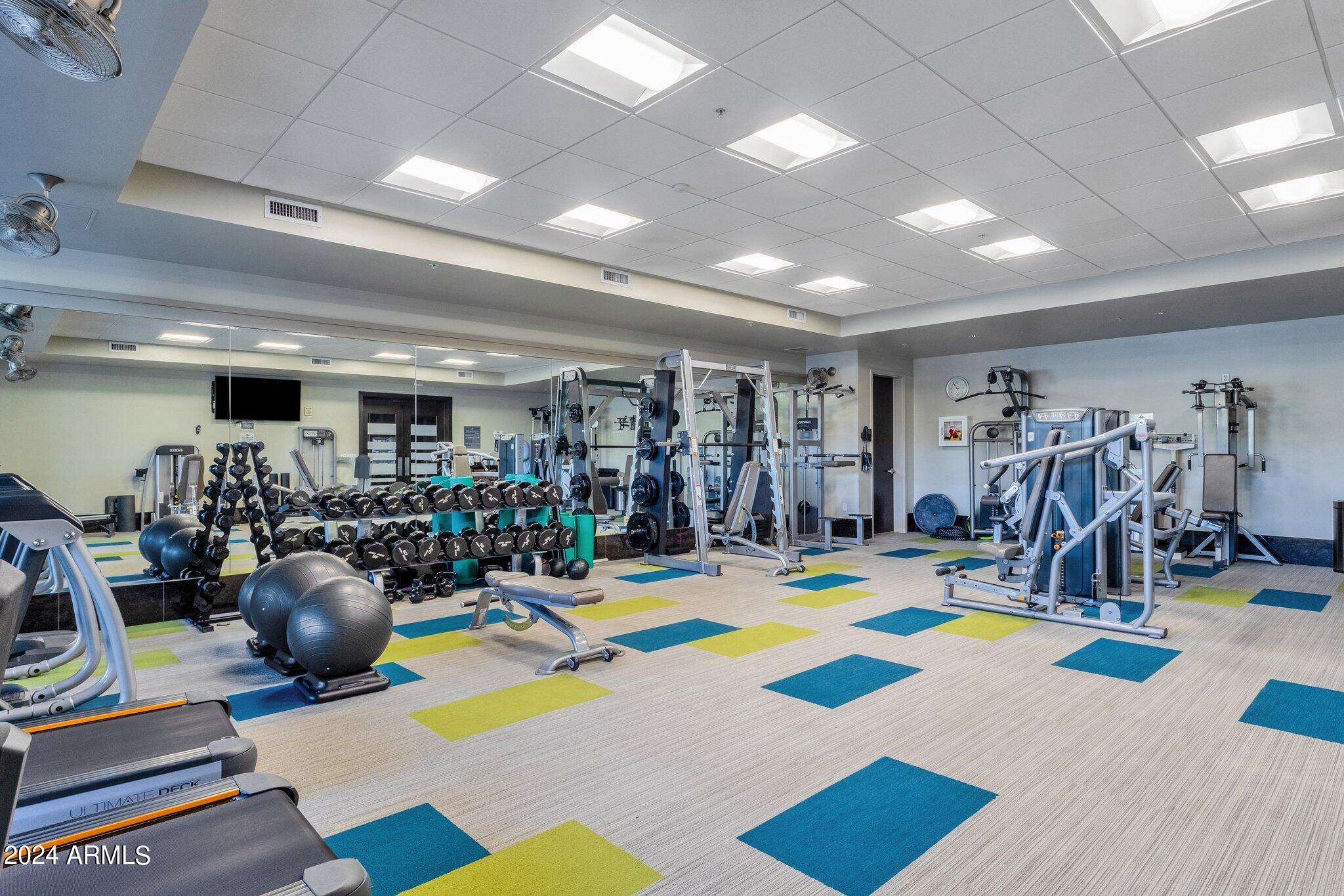 15215 North Kierland Boulevard, Unit 436 Scottsdale, AZ 85254 - Photo 31 of 44 a view of a room with gym equipment