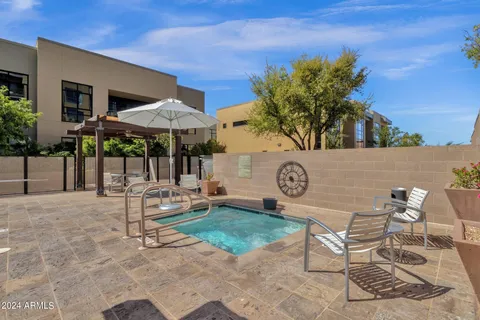 a view of a livingroom with furniture and a hallway