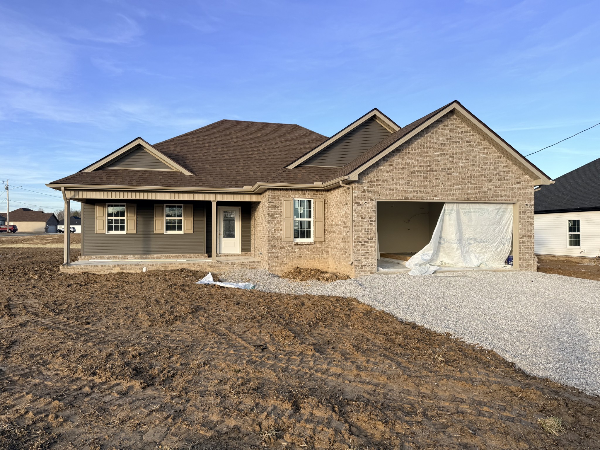 418 Ridge Street Manchester, TN 37355 - Photo 6 of 16 a front view of a house with a yard and garage