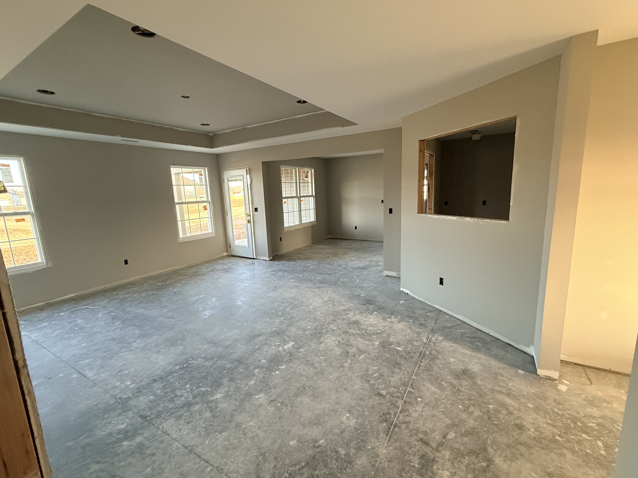 418 Ridge Street Manchester, TN 37355 - Photo 8 of 16 a view of a big room with windows and chandelier fan