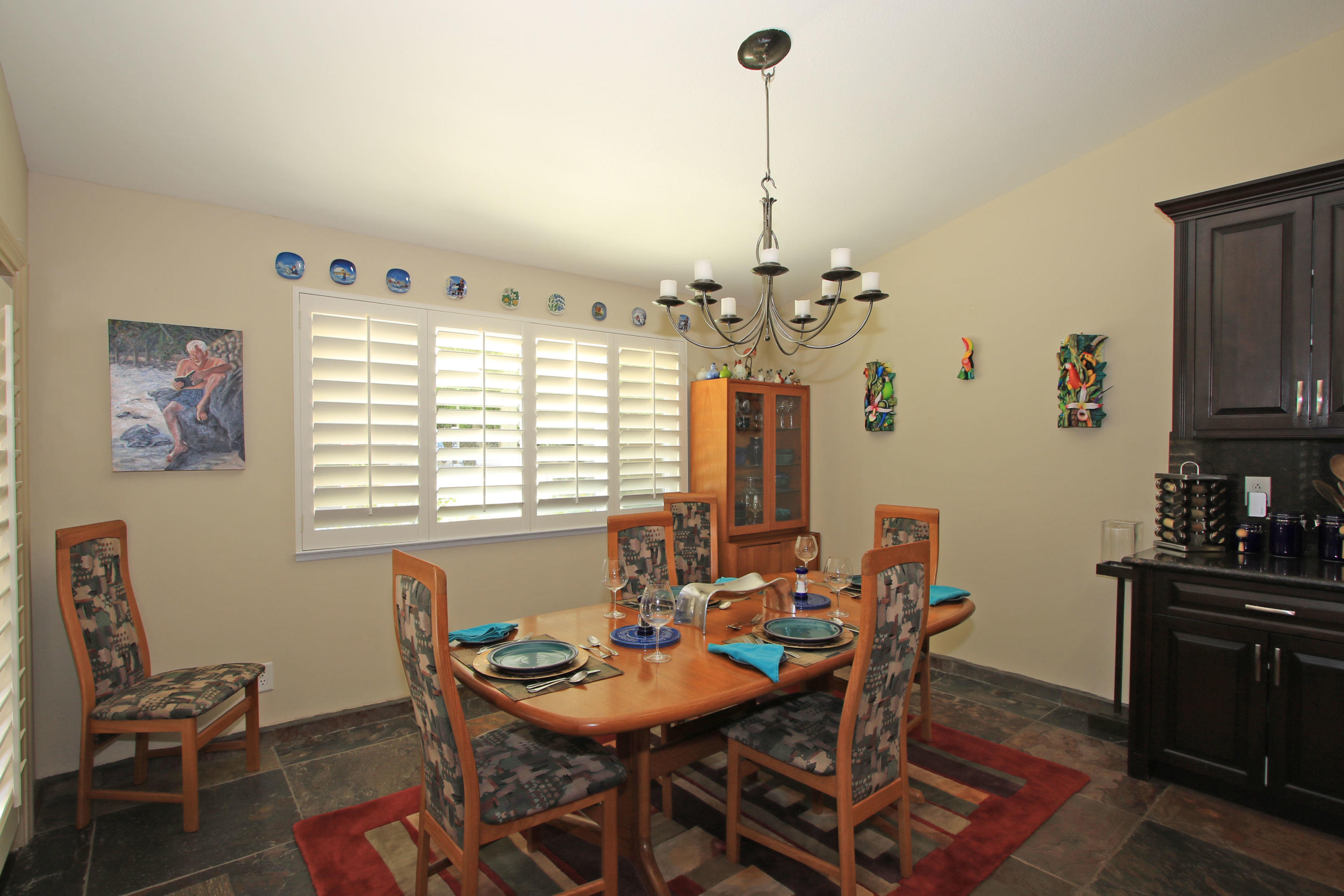 39730 Regency Way Palm Desert, CA 92211 - Photo 12 of 35 a view of a dining room with furniture window and wooden floor