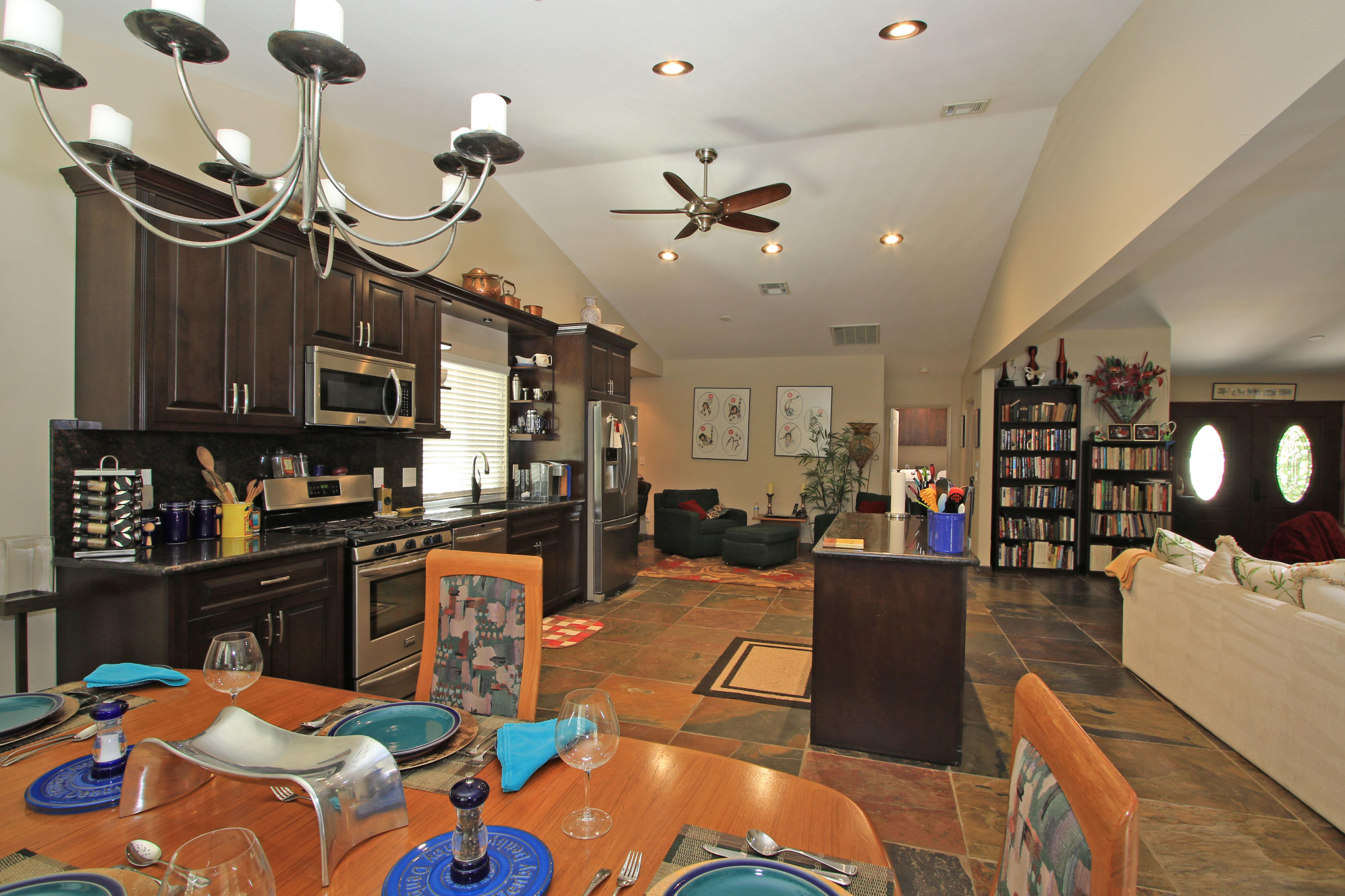 39730 Regency Way Palm Desert, CA 92211 - Photo 15 of 35 a living room with lots of furniture and kitchen view