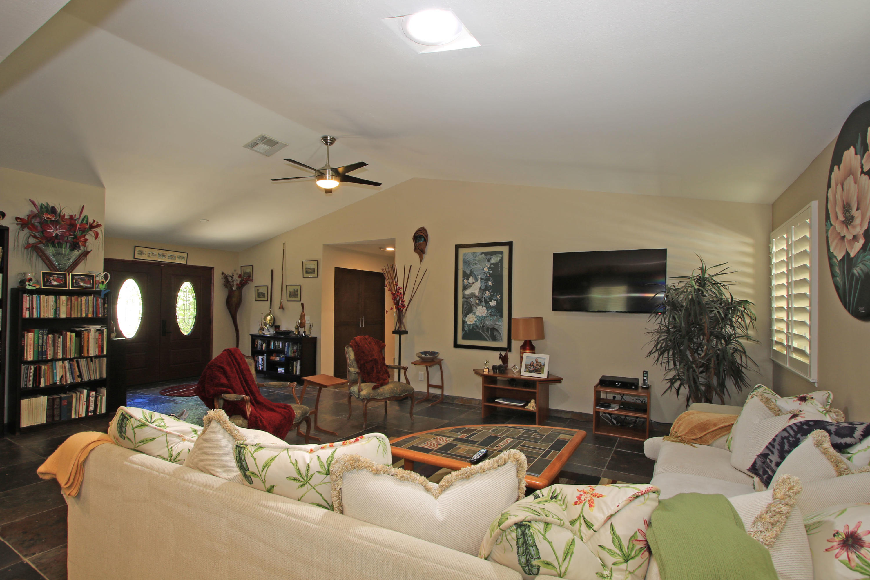 39730 Regency Way Palm Desert, CA 92211 - Photo 20 of 35 a living room with furniture and a large mirror with rug