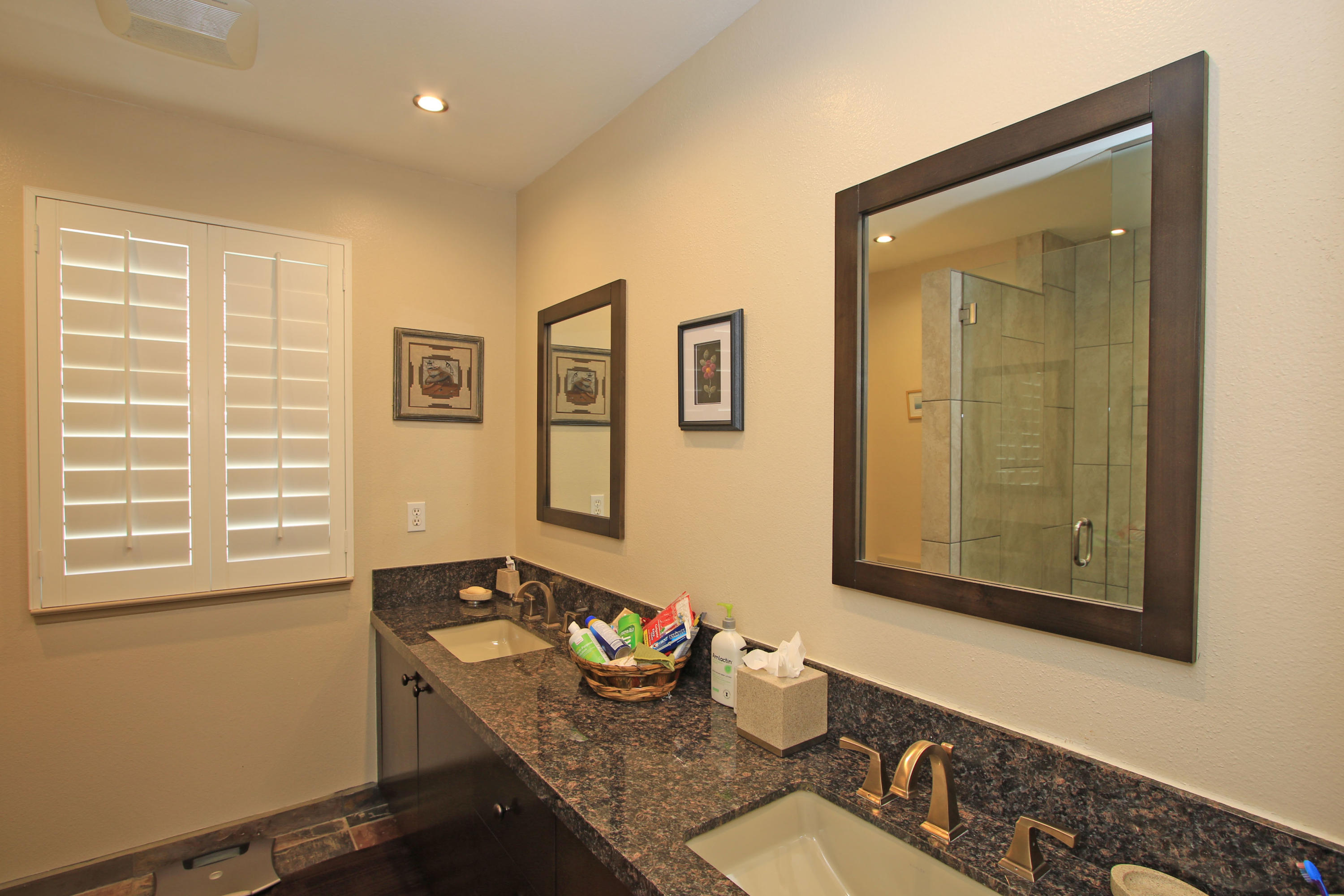 39730 Regency Way Palm Desert, CA 92211 - Photo 33 of 35 a bathroom with a granite countertop sink and a mirror