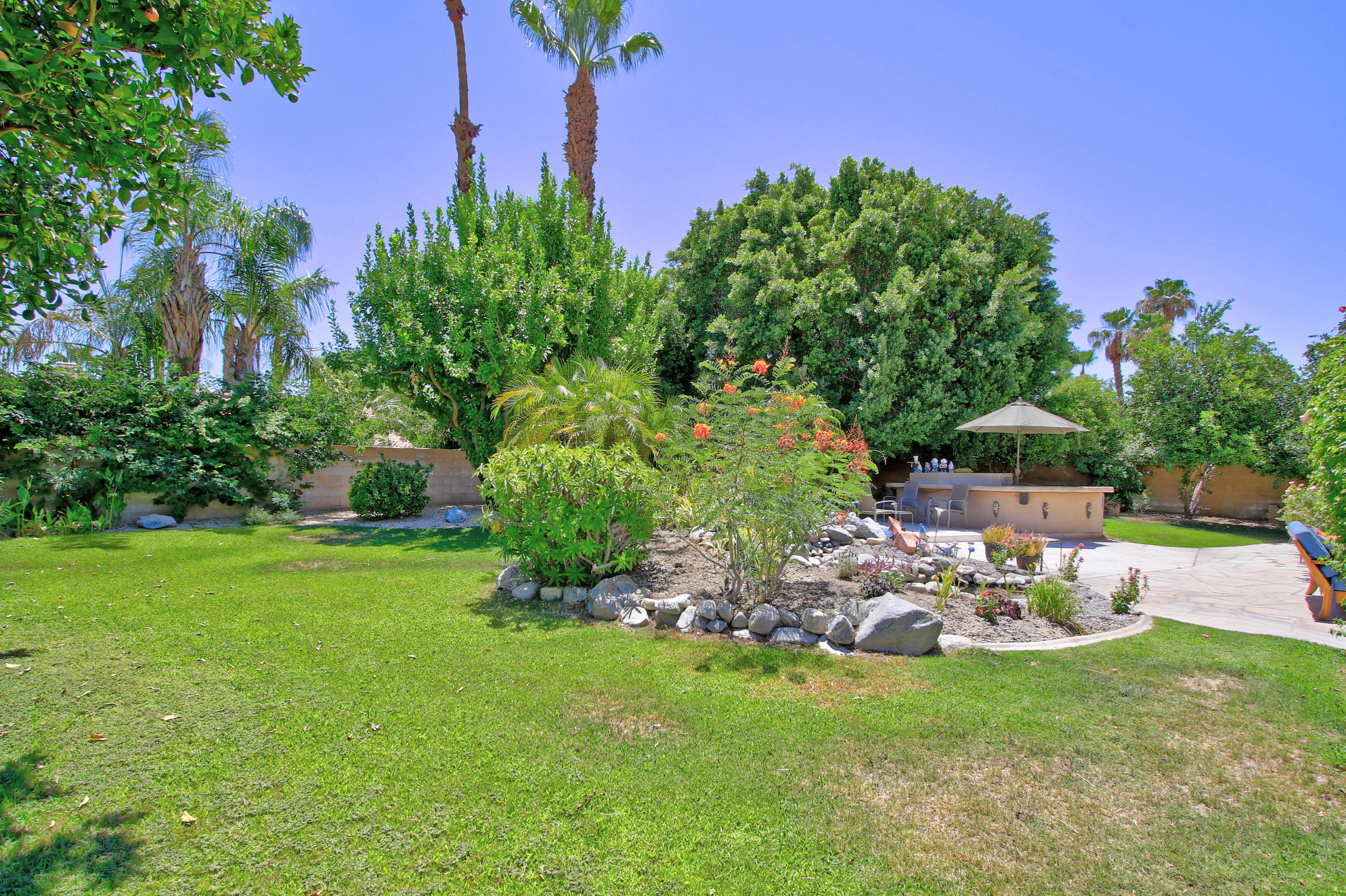 39730 Regency Way Palm Desert, CA 92211 - Photo 34 of 35 a view of a chair and table in backyard of the house