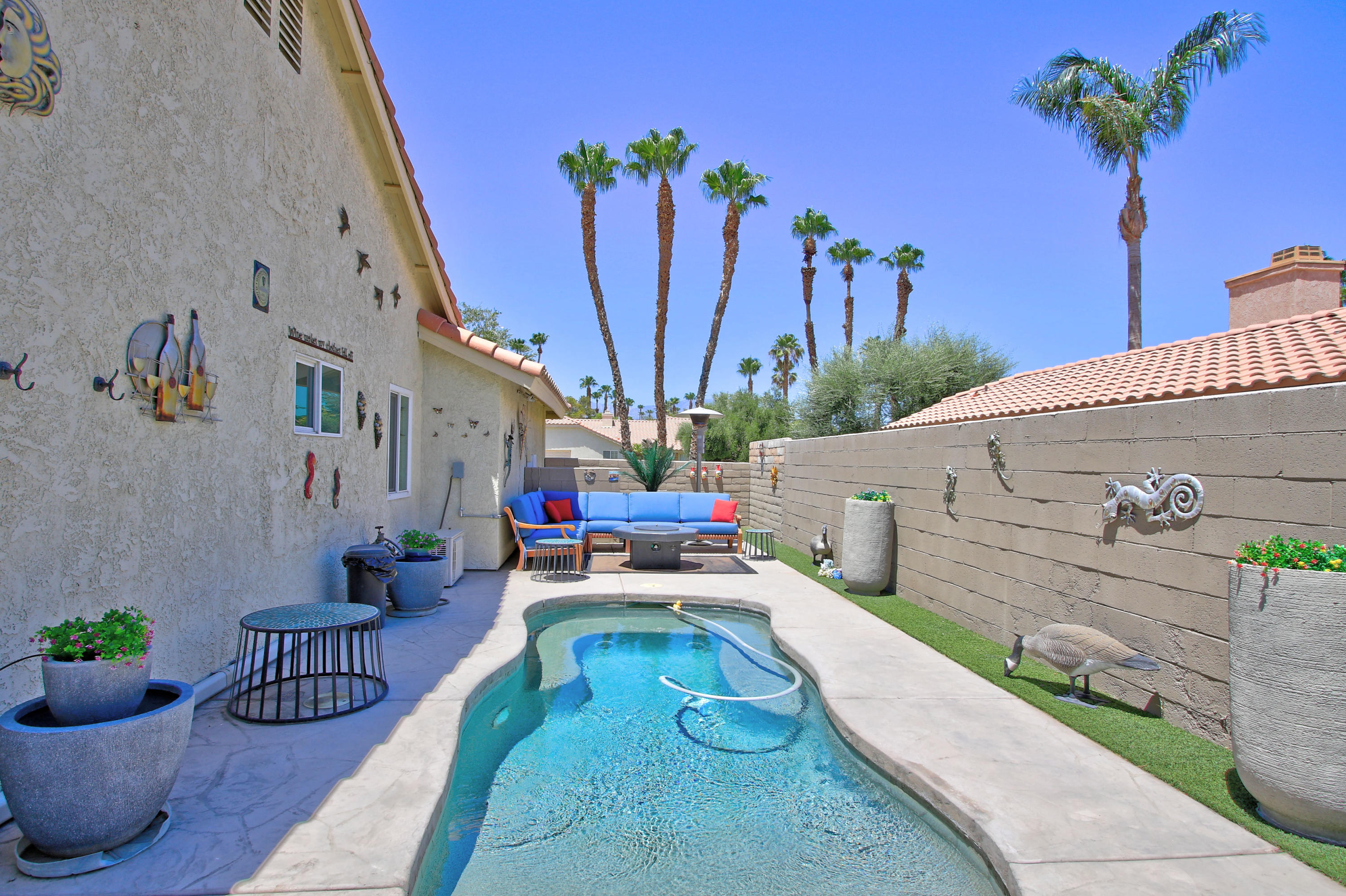 39730 Regency Way Palm Desert, CA 92211 - Photo 5 of 35 a view of a patio with plants and table