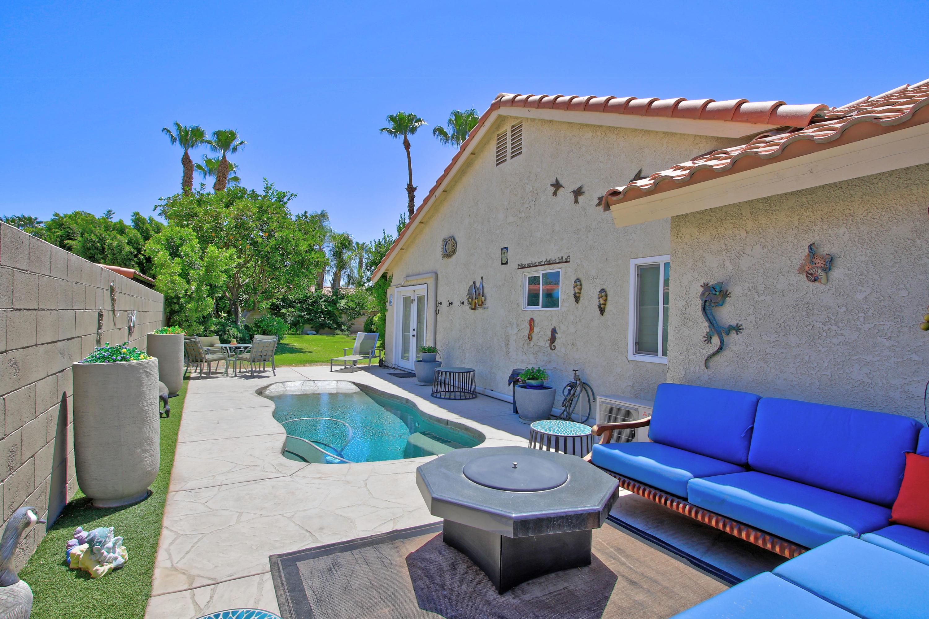 39730 Regency Way Palm Desert, CA 92211 - Photo 6 of 35 a view of a couches in patio of the house