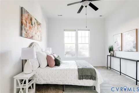 a bedroom with a bed and window