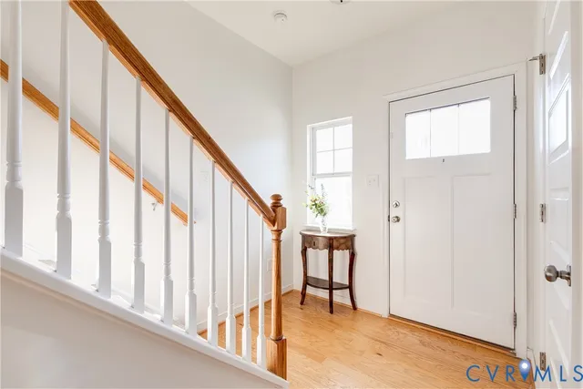 a view of an entryway with wooden floor