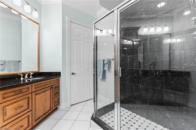a bathroom with a shower sink and mirror