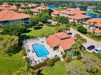 an aerial view of residential houses with outdoor space and street view