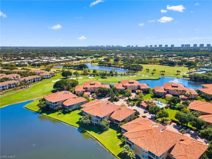 an aerial view of a pool patio swimming pool and lake view