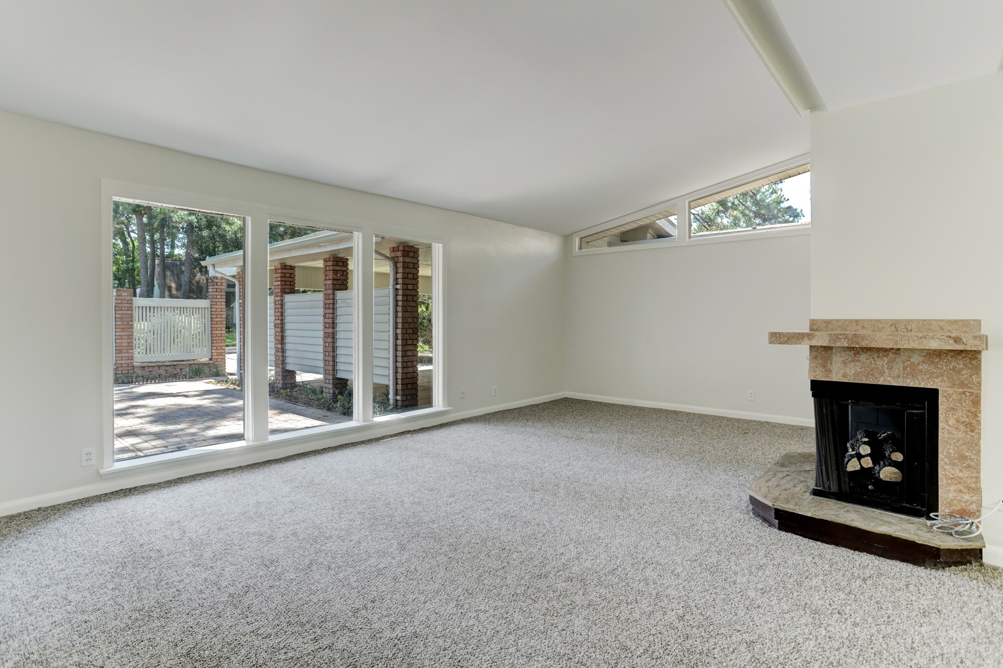 10226 Ivyridge Road Houston, TX 77043 - Photo 6 of 37 Fireplace and living area looking toward the front courtyard