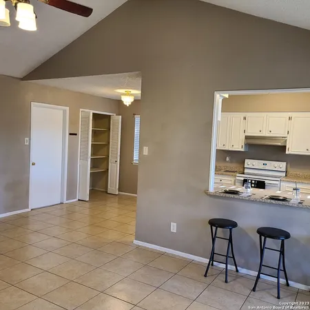 a view of kitchen with furniture and window