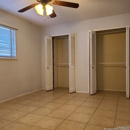 an empty room with fan