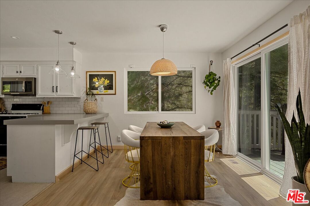 27975 St Bernard Lane Lake Arrowhead, CA 92352 - Photo 11 of 45 a kitchen with a sink cabinets and window