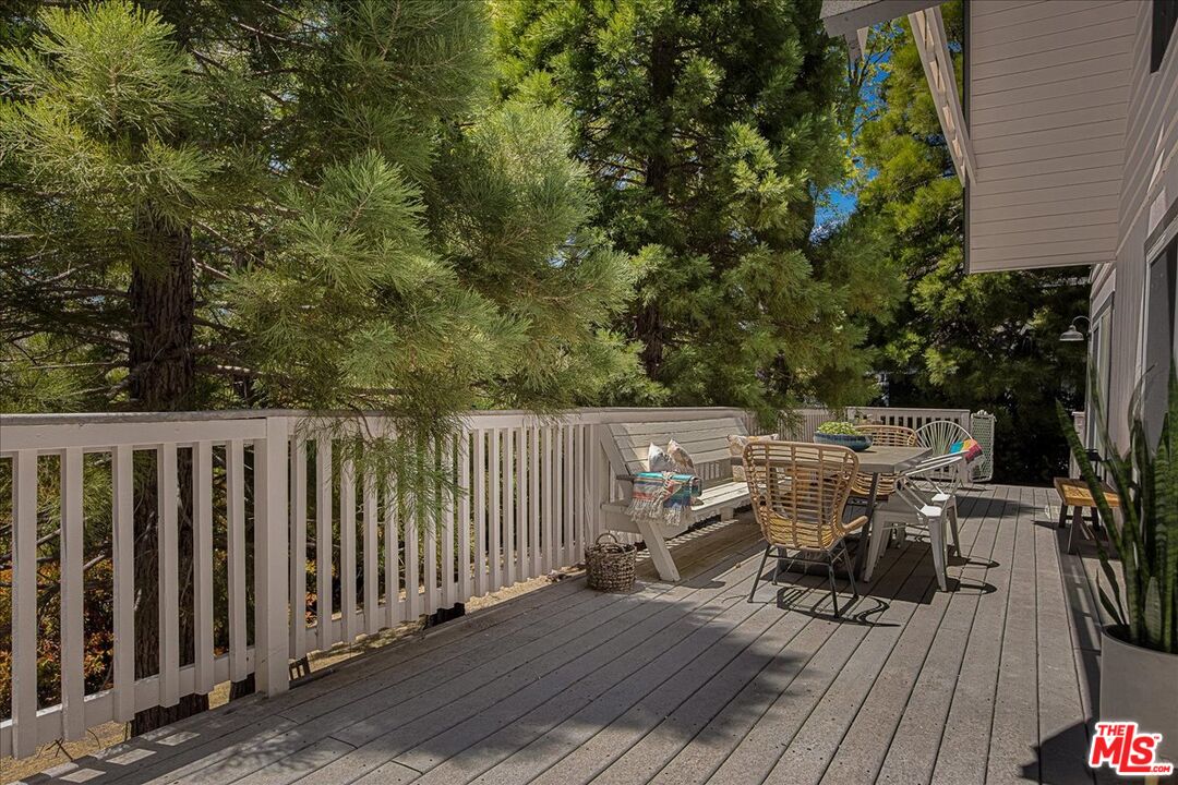 27975 St Bernard Lane Lake Arrowhead, CA 92352 - Photo 17 of 45 a view of balcony with wooden floor and seating space