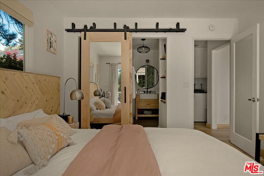 27975 St Bernard Lane Lake Arrowhead, CA 92352 - Photo 21 of 45 a bedroom with a bed and a mirror