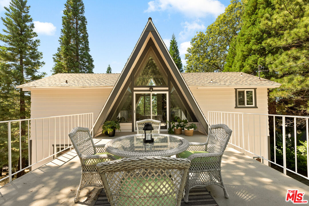 27975 St Bernard Lane Lake Arrowhead, CA 92352 - Photo 29 of 45 a view of house with outdoor seating space