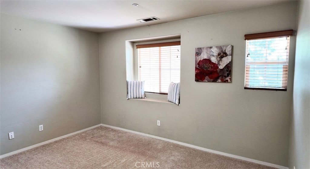 8692 East 9th Street, Unit 56 Rancho Cucamonga, CA 91730 - Photo 18 of 34 an empty room with windows