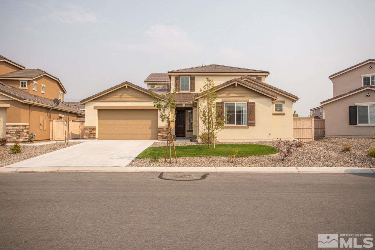 10370 Culiacan Pass Trail Reno, NV 89521 - Photo 1 of 25 a front view of a house with a garden and pathway