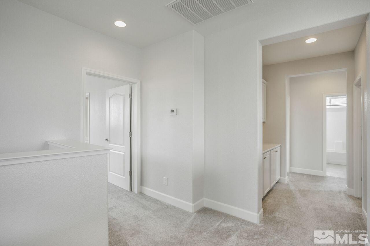 10370 Culiacan Pass Trail Reno, NV 89521 - Photo 14 of 25 an empty room with mirror